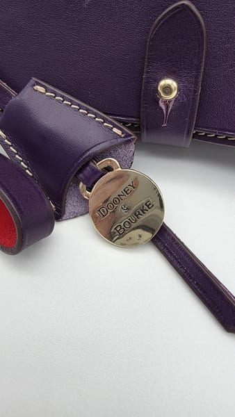 Dooney & Bourke Purple Leather Wristlet Red Lining Silver Hardware Charm, photo 3 of 10